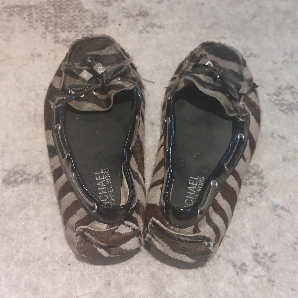 MICHAEL Michael Kors Brown and Beige Zebra-Print Moccasin Flats - Picture 3 of 5